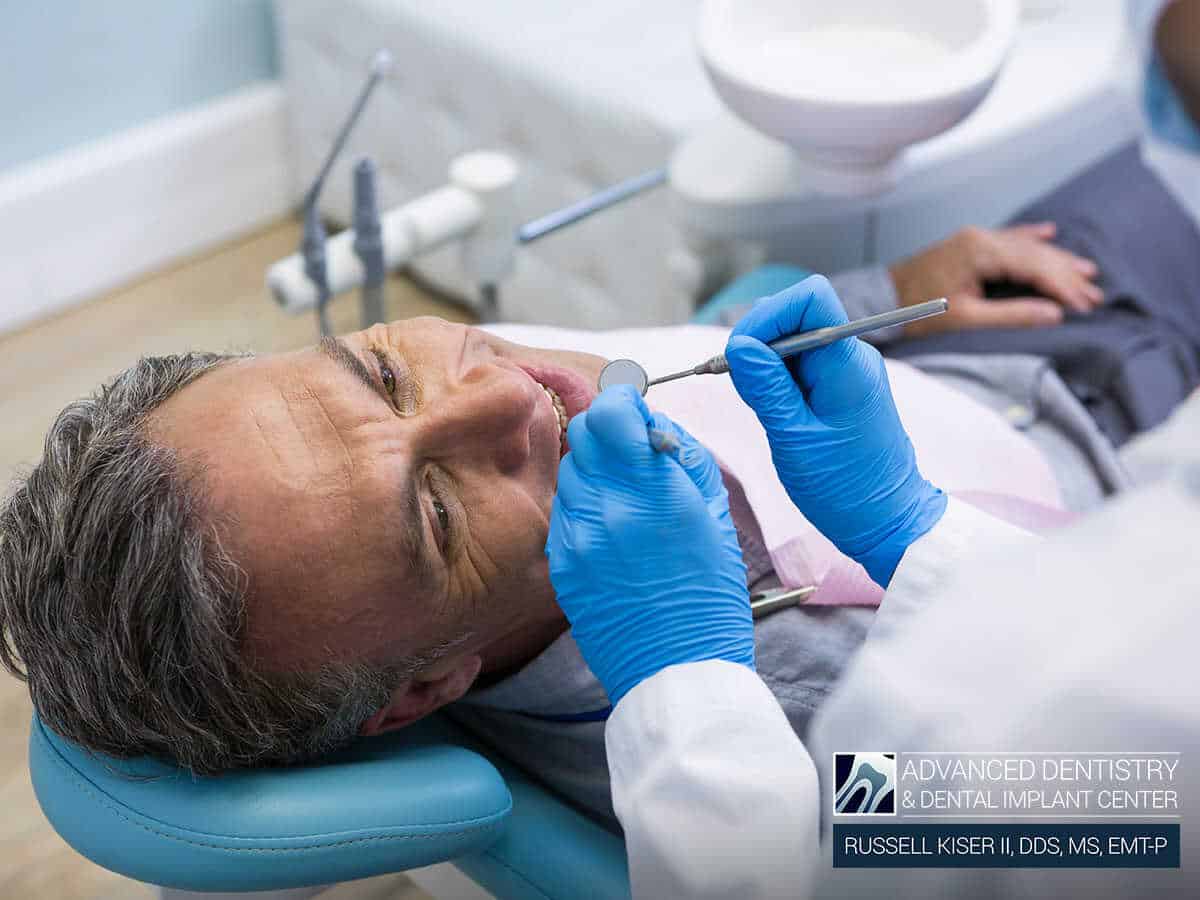 An endodontist treating a tooth decay in Mansfield, OH.