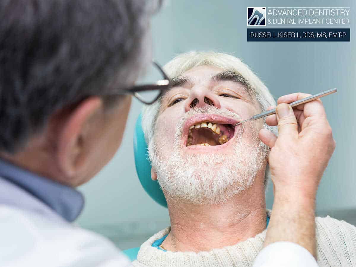 A man having his teeth checked out by a professional endodontist in Mansfield, OH
