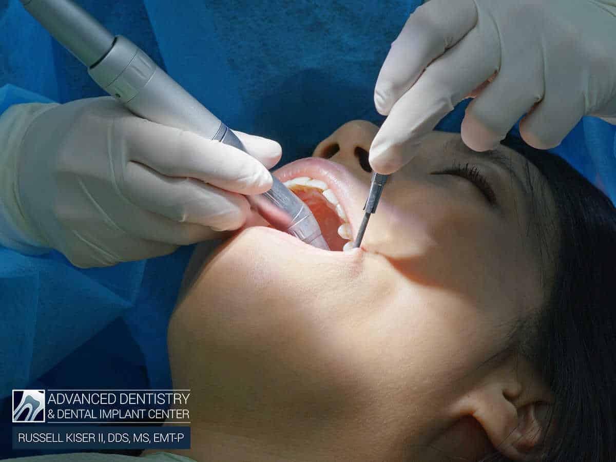 A woman having her dental implants checked in Mansfield, OH
