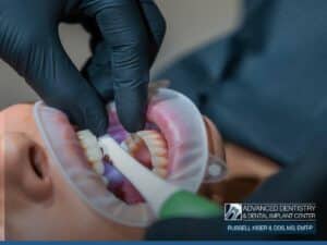 Dentist placing Dental Implants to restore missing teeth and oral function