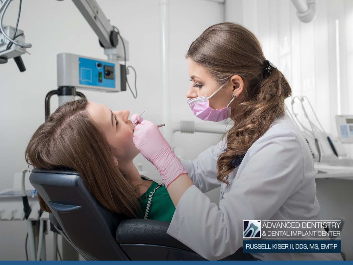 Dentist performing endodontic treatment on a patient in a dental clinic.