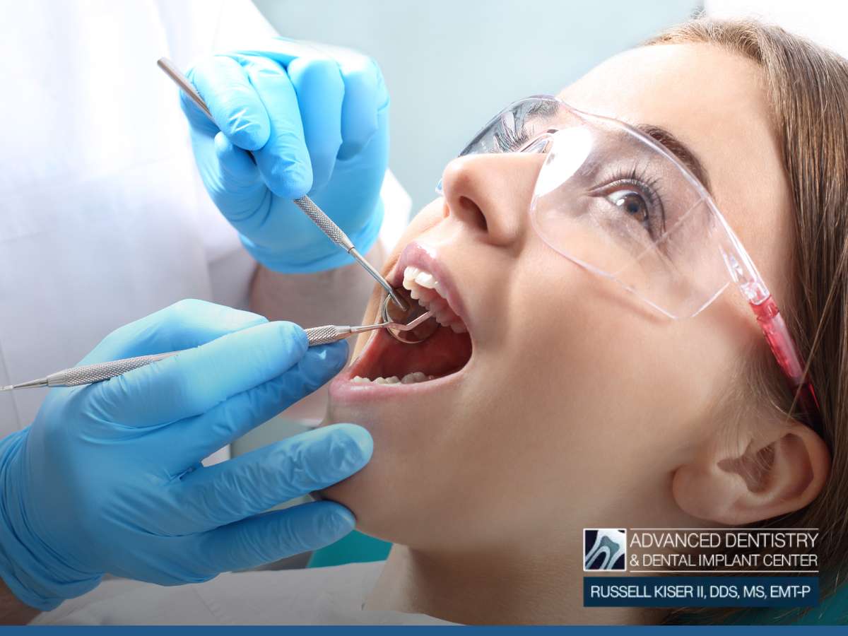 Patient receiving dental care, possibly related to root canal therapy, at Advanced Dentistry & Dental Implant Center