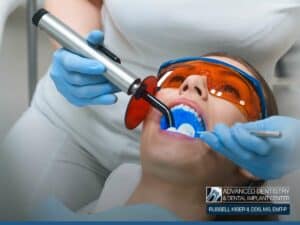 A dentist performs a root canal using advanced technology, highlighting the precision and comfort of modern dental procedures at Advanced Dentistry