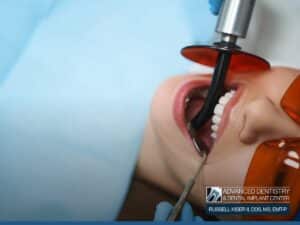 A patient undergoing a root canal procedure at Advanced Dentistry, showcasing modern dental technology for improved comfort and precision