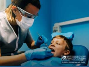 Young boy receiving a Check-Up by a Children Dentist at Advanced Dentistry & Dental Implant Center with Dr. Russell Kiser