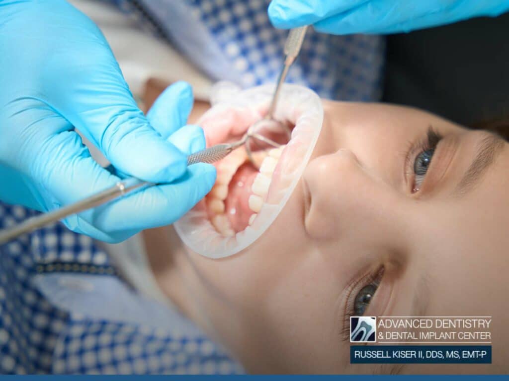 Dental exam for child, with focus on identifying and treating dental cysts