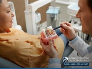 A dentist explaining the Signs You Should Seek Immediate Care after a dental implant